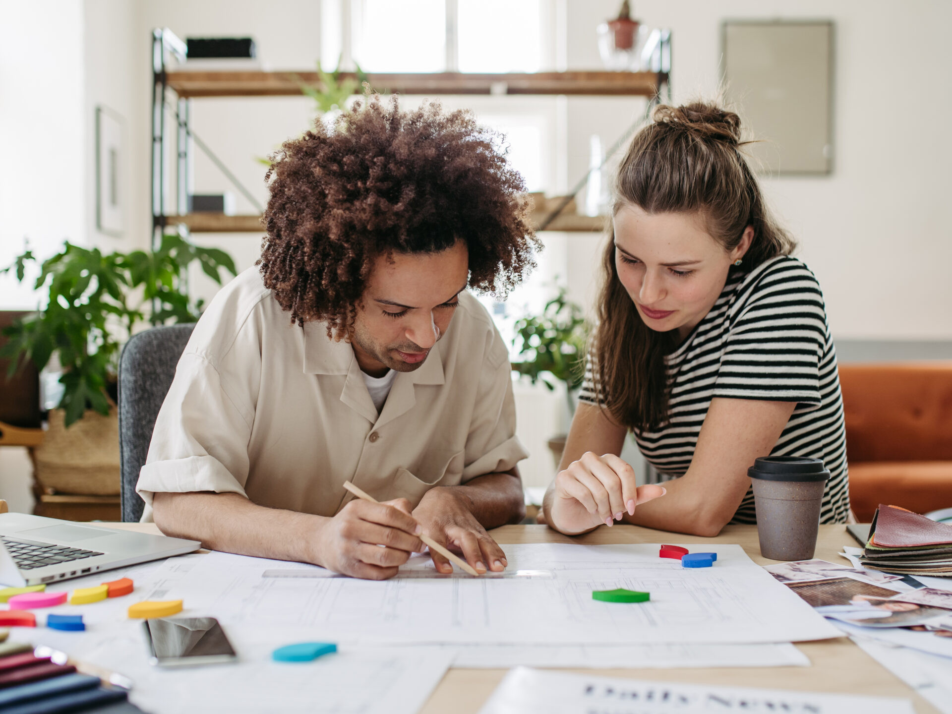 Young colleagues working together in creative atelier.